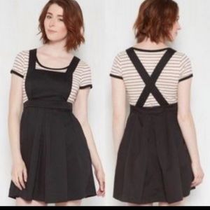 Black pinafore dress with pockets